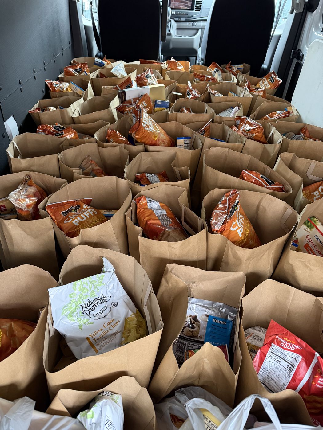 A van full of packed grocery bags