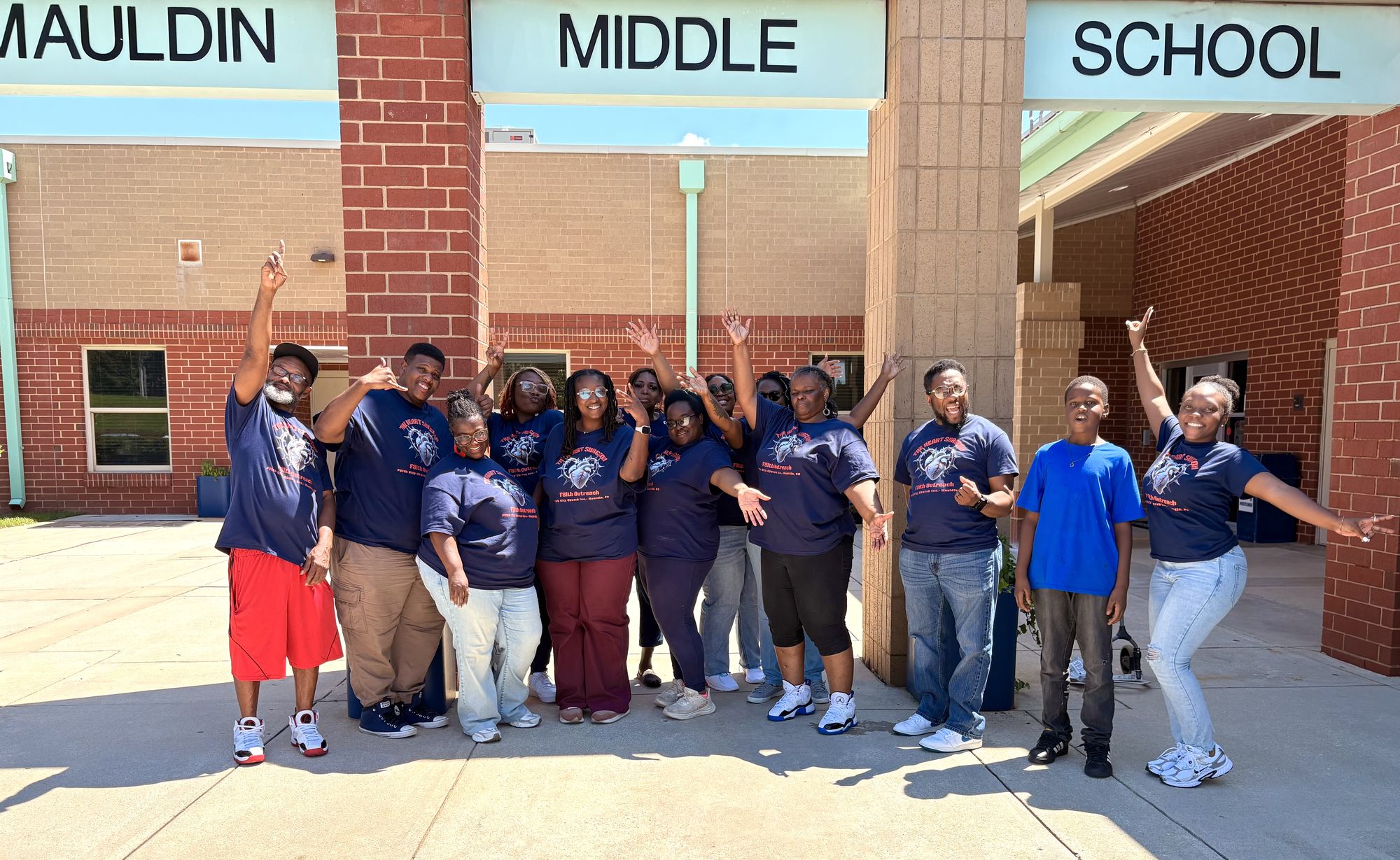 The F8ith outreach team celebrating outside Mauldin Middle School
